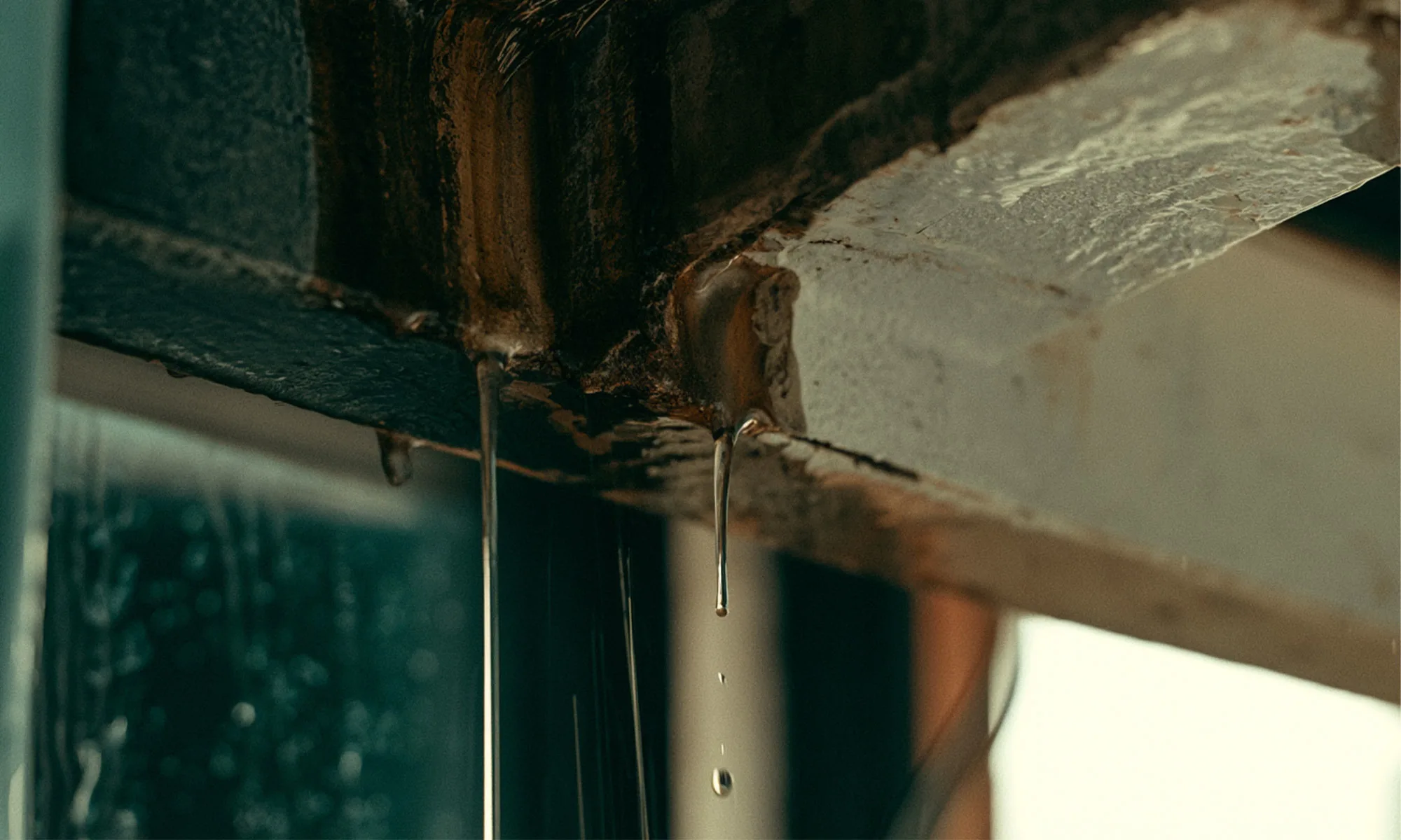 A ceiling with visible water staining, typical of monsoon-related leakage